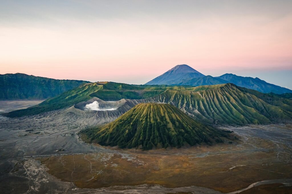 Stunning aerial view of Mount Bromo in East Java, Indonesia, captured at sunrise with vibrant colors.